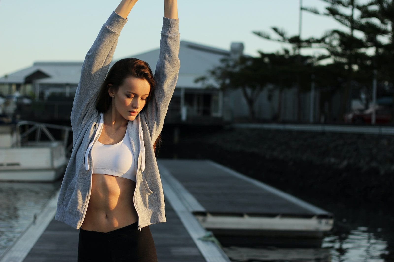 woman standing on dock showing lower abs